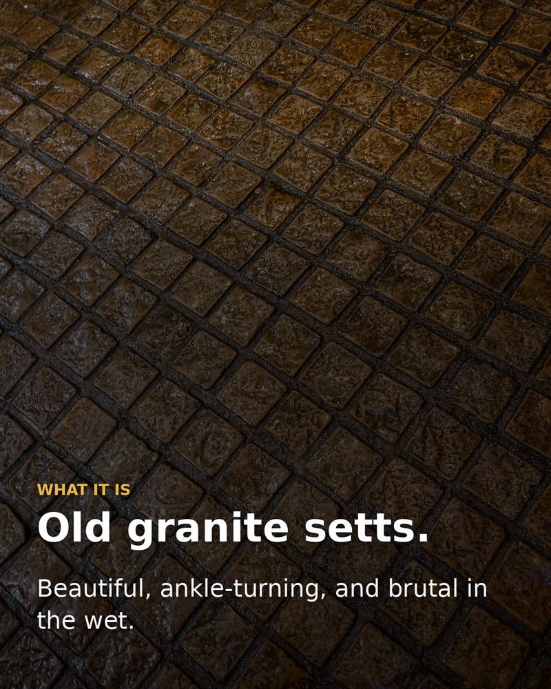 Old granite setts: beautiful, ankle-turning, and brutal in the wet.