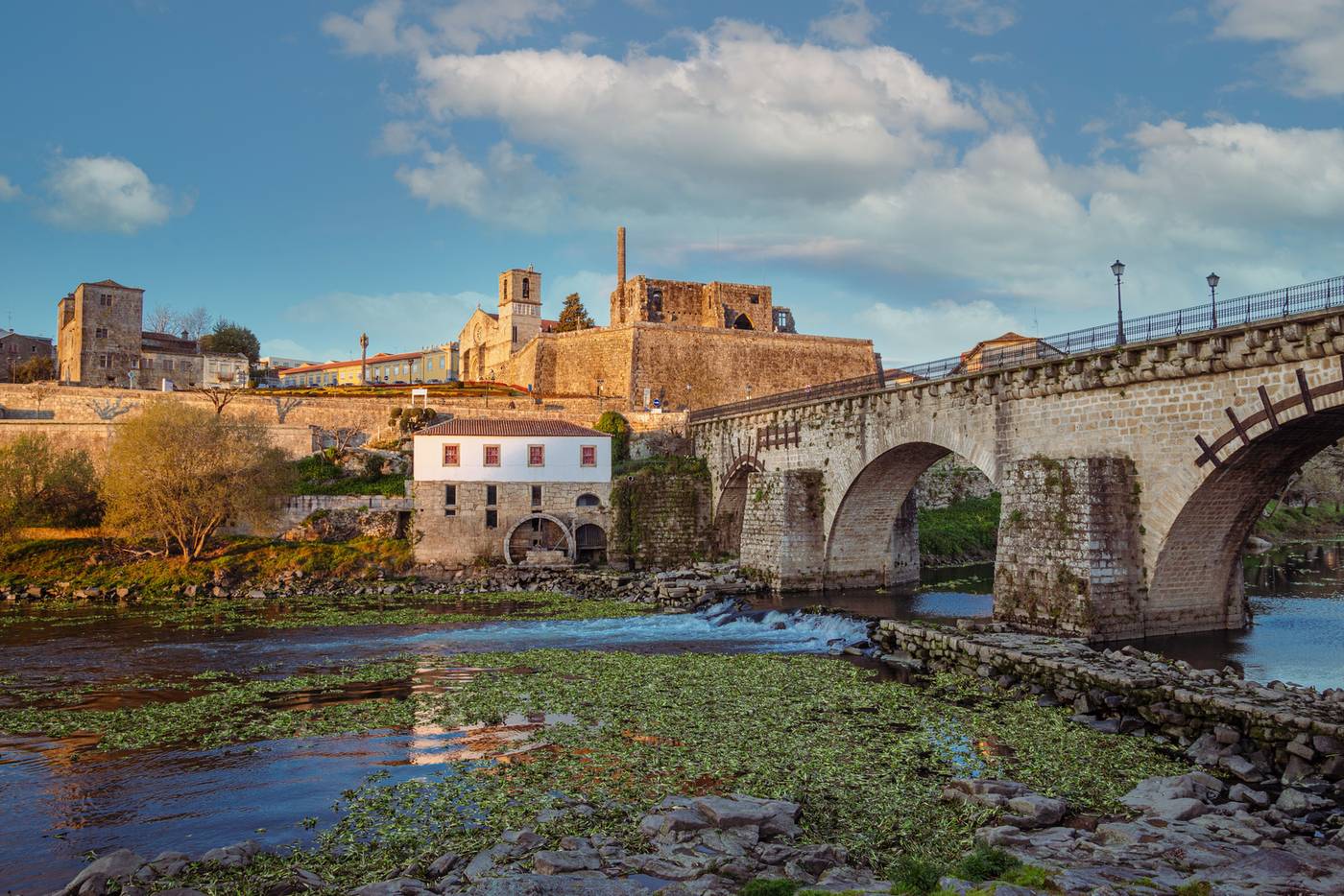 Medieval stone bridge of Barcelos crossing the Cavado river with the historic old town above