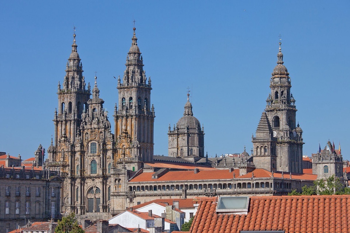 The spires of Santiago de Compostela Cathedral against a blue sky